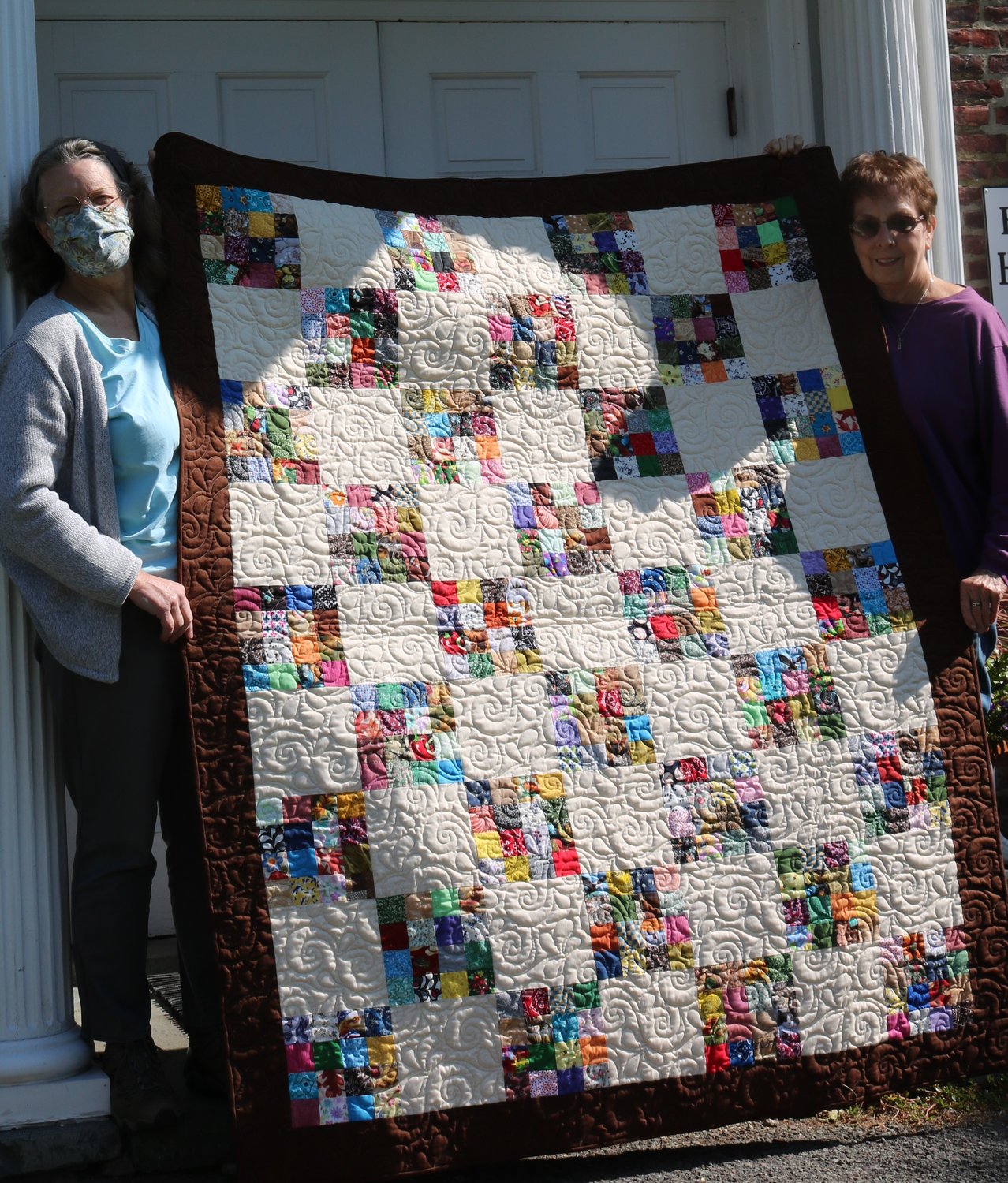 This quilt (62 inches by 76” inches) is one of the prizes in a raffle drawing to raise funds for Bethany Public Library. Holding the quilt are library director Kate Baxter, left, and Nancy Swingle, the quilt’s creator.